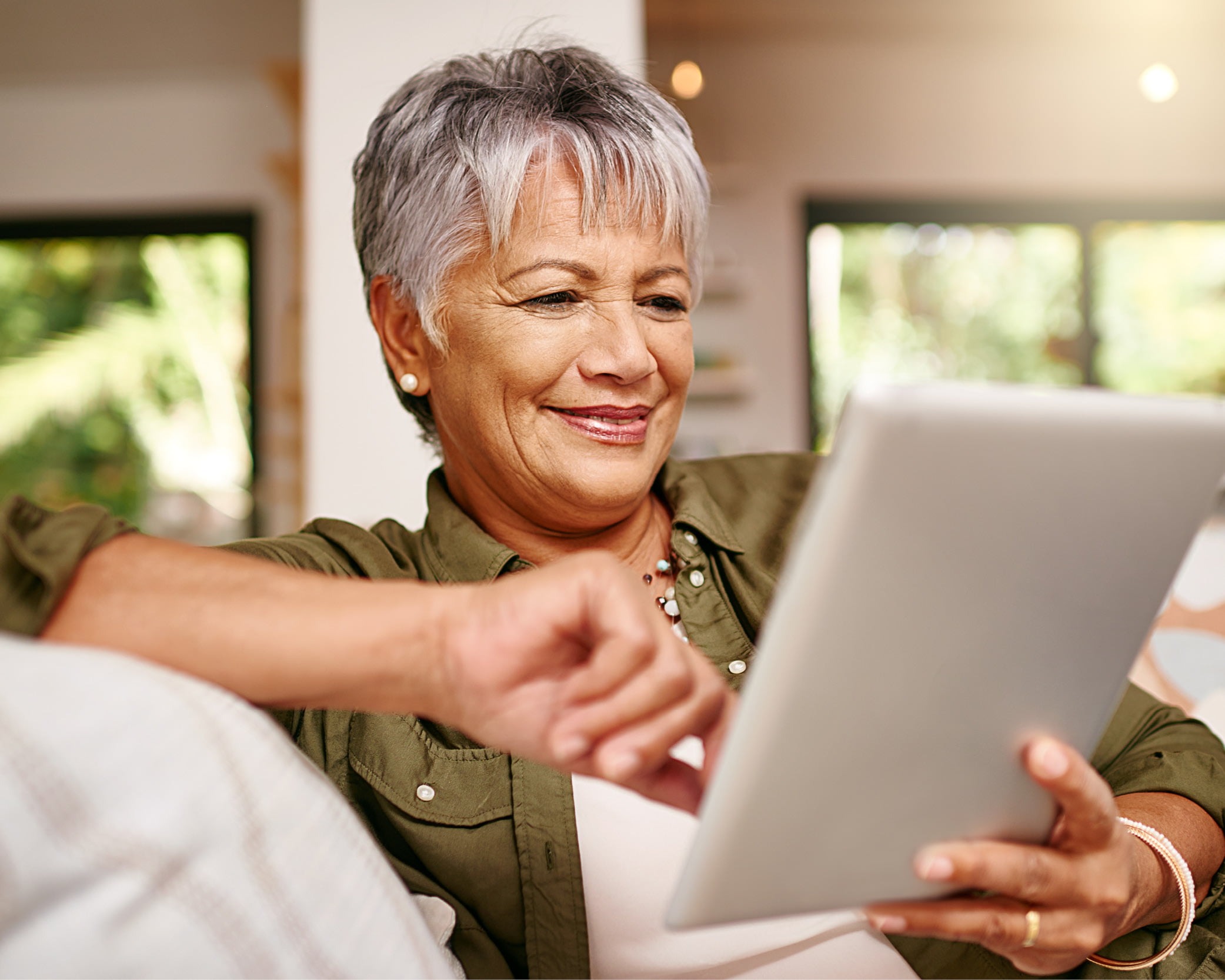 Mid-50s to 60s woman Staying in the the social loop thanks to technology